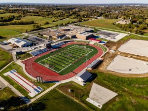 Aerial view of Warrensburg High School with athletic fields and surrounding areas.