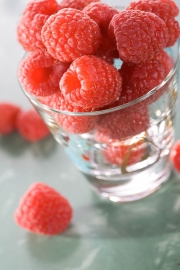 Fresh raspberries in glass