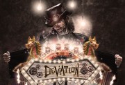 A man wearing a steampunk-style outfit with a top hat, holding a sign that reads \'Deviation\' adorned with carousel horses.