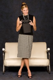 Woman with hadbag with white couch