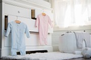 Baby clothing on chest of drawers