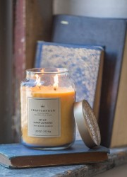 Wild sunflower candle on window sill